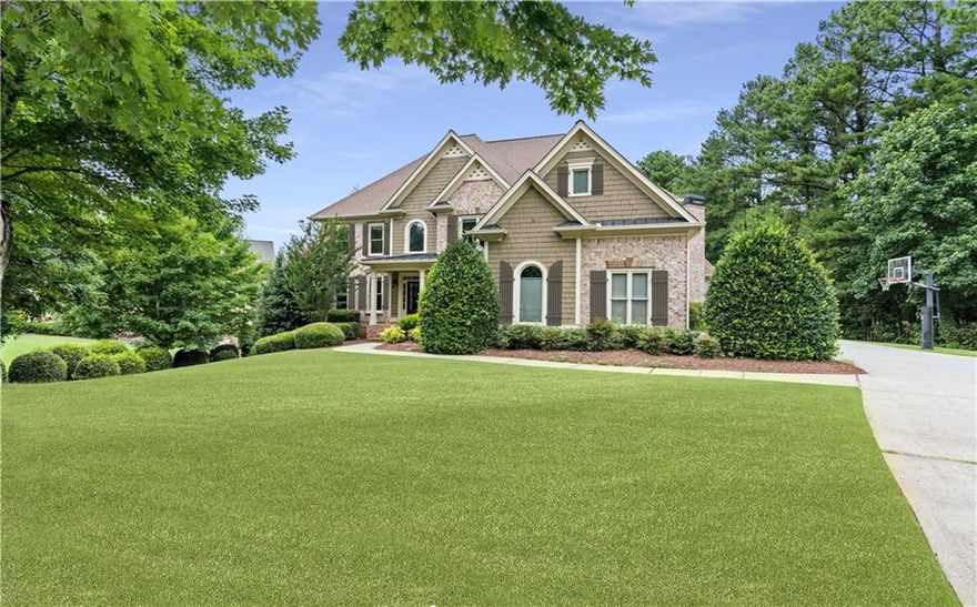 Located within the esteemed community of Creekstone Estates, this spacious 6-bedroom, 5-bathroom home epitomizes luxury and unparalleled convenience. Ideally situated just minutes from GA-400, Halcyon, Downtown Alpharetta, and the upcoming Gathering at South Forsyth, this property offers effortless access to premier shopping, dining, and entertainment. The traditional floor plan is thoughtfully designed, featuring a main-level bedroom and full bathroom, soaring vaulted and beamed ceilings, and elegant coffered details. Built-in bookcase add a touch of sophistication to the living spaces. The chef’s kitchen has been meticulously updated, showcasing a large center island perfect for entertaining, seamlessly flowing into the inviting fireside keeping room. The fully finished basement provides additional living space, adaptable to various needs. Step outside to discover a beautifully landscaped private backyard, complete with a heated pool, offering a serene retreat. Creekstone Estates enhances this exceptional lifestyle with its resort-style amenities, including a 11,000 sq-ft clubhouse, fitness center, 11 lighted tennis courts, a junior Olympic pool, sport courts, and picturesque lakes throughout the community. This residence offers a harmonious blend of elegance, comfort, and convenience, making it a truly remarkable place to call home.