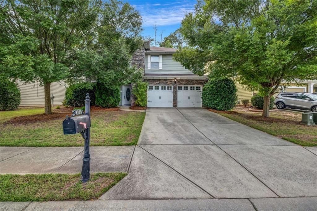 This beautiful two-story home, located in the highly sought-after Hampton Oaks community, showcases one of the original and most desirable floorplans in the neighborhood. The heart of the home is the massive chef's kitchen, complete with a generous center island, solid surface countertops, and stainless steel appliances-perfect for both everyday cooking and entertaining. The main level offers a bedroom and full bathroom, ideal for guests or multi-generational living, as well as spacious living areas that provide comfort and functionality. Upstairs, you'll find a versatile loft area that can be used as a home office, playroom, or media space. The luxurious primary suite boasts a walk-in closet and a spa-inspired bathroom with dual vanities, a soaking tub, and a separate shower. Step outside to enjoy a fully fenced backyard with an oversized patio-perfect for hosting gatherings, grilling out, or simply relaxing in your private outdoor space. Hampton Oaks is a well-maintained community that offers beautiful amenities and a welcoming atmosphere, making this home an exceptional opportunity in one of the area's most coveted locations.