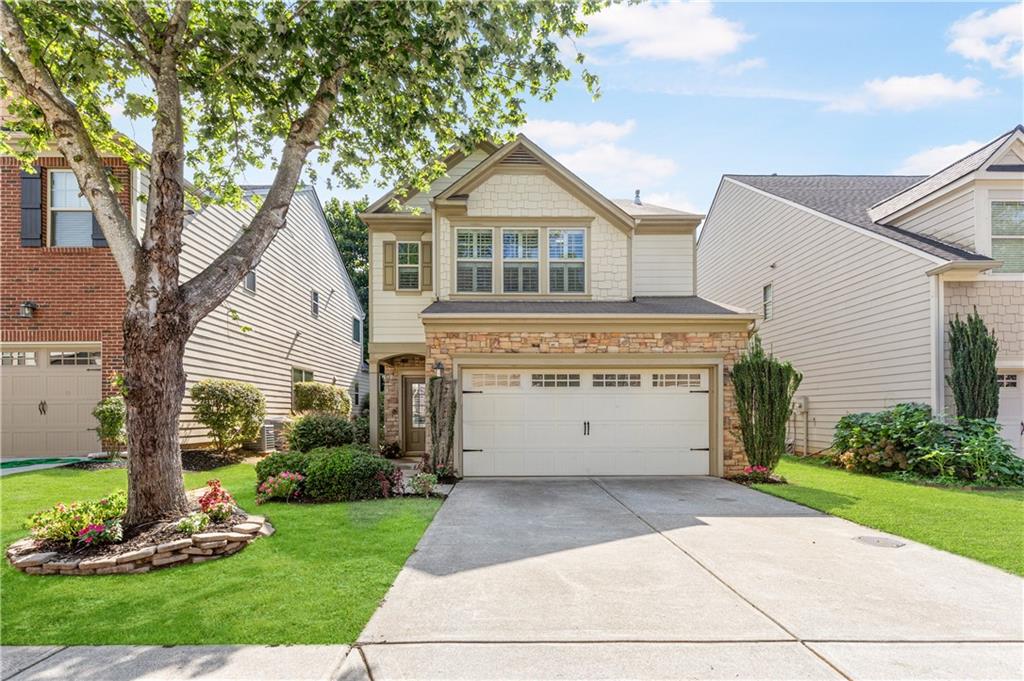 A 10! A perfect craftsman style home located in award winning school district! The main floor features hardwood floors throughout! Chef's kitchen with granite countertops and stainless steel appliances. Walk directly to your private fenced backyard with patio. Three large bedrooms including a master suite with gorgeous master bath! Neighborhood pool and easy access to GA400 via Windward or McFarland Rd. Minutes to the Greenway, restaurants, shops, etc. If it's location, condition and lifestyle you're looking for, you found it!