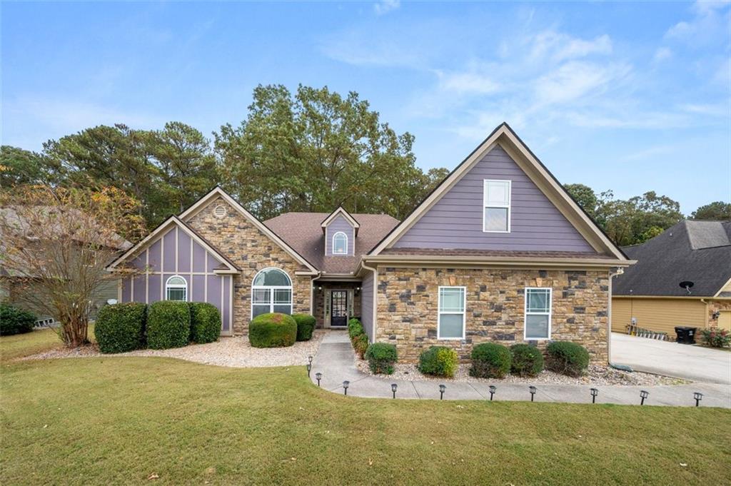 PRICE IMPROVED!!! Welcome to this stunning, spacious 4-bedroom, 2.5-bath ranch-style home with a versatile upstairs bonus room ideal for a teen or in-law suite, situated on a private, large lot with a beautiful, natural landscape. As you step inside through the grand two-story entrance, you’re welcomed by an inviting foyer and laminate flooring that flows through all main living areas. The high ceilings throughout provide a light, airy feel in each room.
The home features a formal dining room for gatherings, a cozy family room with a fireplace, and a large, well-appointed kitchen with a central island and tile floors. Adjacent to the kitchen is a bright sunroom that opens onto a screened porch, perfect for enjoying the view or relaxing in the hot tub.
The expansive primary bedroom suite includes a flex space or sitting area with a charming barn door for added privacy. The primary bathroom features tile floors, dual vanities with cultured marble, and ample storage with dual walk-in closets. Secondary bedrooms also boast high ceilings and share a double-vanity bathroom with tile floors. This home is designed for comfort and flexibility. Additional features include a three-car side-entry garage, built-in shelving, a dog run, separate grilling area, and a water filtration system and Choice Home Warranty are included, as well as all appliances. Move-in ready with barely new carpet, ceiling fans throughout, and a convenient laundry closet—this home offers both luxury and functionality in a peaceful, private setting. HOMESTEAD EXEMPTION NOT APPLIED.