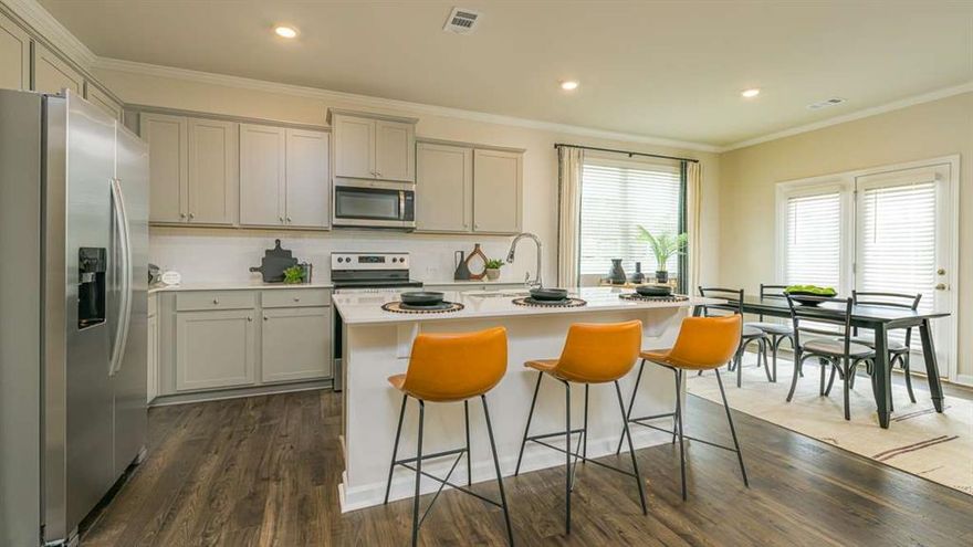 The Salisbury Floor Plan is a newly constructed, two-story townhome designed for modern living. This spacious home features three bedrooms, 2.5 bathrooms, and a two-car garage. The open-concept main floor boasts a stylish kitchen with 42C cabinets, crown molding, a chic tile backsplash, and elegant quartz countertops. The space flows seamlessly into a cozy living area and a dining spaceCoperfect for entertaining. Upstairs, two secondary bedrooms share a convenient Jack-and-Jill bathroom and offer generous walk-in closets. The primary suite serves as a private retreat, complete with an en-suite bath and a spacious walk-in closet. With contemporary finishes, ample storage, and a low-maintenance exterior, this townhome blends comfort and functionality in a prime Barrett Parkway locationCojust minutes from parks, dining, and shopping.