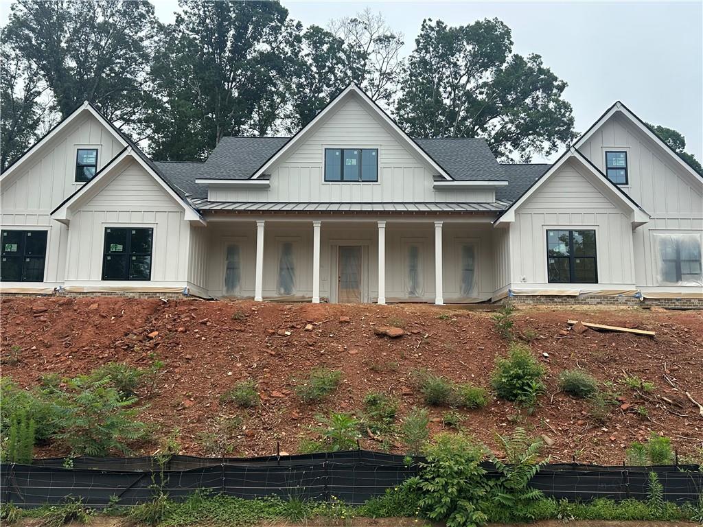 AMAZING custom Modern Farmhouse design in the established Sandy Creek golf course community in North Jackson County, close to Athens. This beautiful floor plan provides 4 bedrooms on the main level with a bonus and full bath on the upper level. The office and dining room great you upon entry into the impressive foyer that leads you to the Open concept which lays across the back of the home with picture windows, gourmet custom kitchen with quartz counters, pot filler, large island and double ovens. The living area offer wood style flooring, wetbar, accent walls recessed lighting along the trey ceilings. Primary suite provides peace and quiet in its own wing with a luxury bath offering a bidet, large tiled shower & separate stand alone tub. Secondary bedrooms on main with one ensuite with own entry. Large bonus room on second level with a full bath. This design provided covered porches flanking the front and back. This design flows effortlessly that is sure to please.