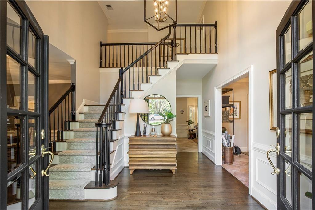 Welcome to this beautifully updated residence in the highly sought-after Wildwood Springs community. Enter through the expansive two-story foyer, where abundant natural light and refined details set the tone for the elegance found throughout this home. Every element has been thoughtfully curated to blend timeless style with modern comfort.
The renovated chef’s kitchen features quartz countertops, stainless steel appliances, custom cabinetry, and a stylish island that opens to the fireside keeping room, creating a warm and inviting space for everyday living and entertaining.
The luxurious primary suite is a serene retreat offering a spa-inspired bath with a soaking tub, frameless glass shower, dual vanities, and custom-designed closets for elevated organization and comfort.
The finished terrace level is an entertainer’s dream — complete with a custom bar, home theater, fitness studio, guest bedroom, and full bath. Perfect for movie nights, workouts, or weekend guests.
Outdoor living shines with a screened porch, deck, and firepit area surrounded by lush landscaping — ideal for year-round relaxation and gatherings under the stars.
Situated in one of Roswell’s most desirable neighborhoods, offering resort-style amenities, top-rated schools, and convenient access to historic downtown Roswell, parks, shops and restaurants — this home truly has it all.