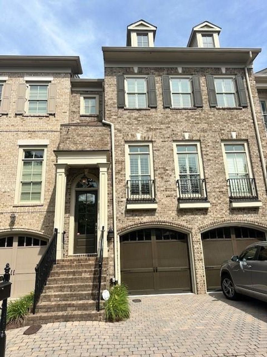 AMAZING LOCATION! Tucked within an exclusive gated enclave, this stunning three-bedroom, three-and-a-half-bath townhome offers luxurious living with timeless design, custom built by the renowned John Willis Homes. Thoughtfully designed with elevator-ready access, the residence blends elegance and convenience across every detail.

Upon entry, you're welcomed by beautifully appointed interiors featuring spacious open-concept living areas, rich hardwood flooring, and designer finishes throughout. The fireside master suite offers a tranquil retreat with a cozy fireplace, spa-like bath, and expansive walk-in closet. Step out to your private screened porch from the main living level—perfect for relaxing or entertaining while enjoying peaceful views.

The chef's kitchen seamlessly flows into the dining and living spaces, ideal for modern living and hosting. The garage is a dream—fully insulated with custom built-in cabinetry, a sink, and refrigerator, perfect for storage or hobby space.

Just a short walk to shops and restaurants, this home is ideally located within a vibrant, well-maintained community. Enjoy lighted, tree-lined sidewalks that lead to an impressive array of amenities: a resort-style swimming pool, tennis courts, state-of-the-art exercise facility, wooded walking trails, playground, basketball court, business center, and a sprawling green space along the scenic Chattahoochee River.

This residence offers the perfect blend of luxury, lifestyle, and location—your private retreat in a vibrant, amenity-rich community.