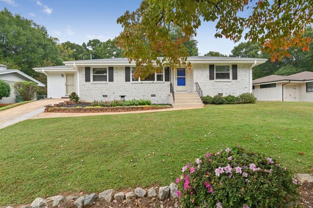 Welcome Home to this Traditional Brick Ranch on Nearly Half Acre to Stretch Your Arms and be Creative! The Updated Kitchen has New Tile, White Cabinets and Stainless Appliances with a Large Separate Dining Room for Entertaining! The House Also has a Sought After Private Office Space or Play Room with Access to the Fenced Back Yard! All the Hardwoods Floors Have Recently Been Refinished and New Shutters Add an Extra Touch and Will Have You Planning the Move! Be Sure to Check Out the Bonus Storage Shed and Play Area out Back! Close To Shopping, Atlanta, Truist Park and Lake Court Park which is located at the end of the street. The park is heavily wooded and includes a playground, volleyball court, pavilion with picnic tables, off-leash dog park, and an open grassed playfield.