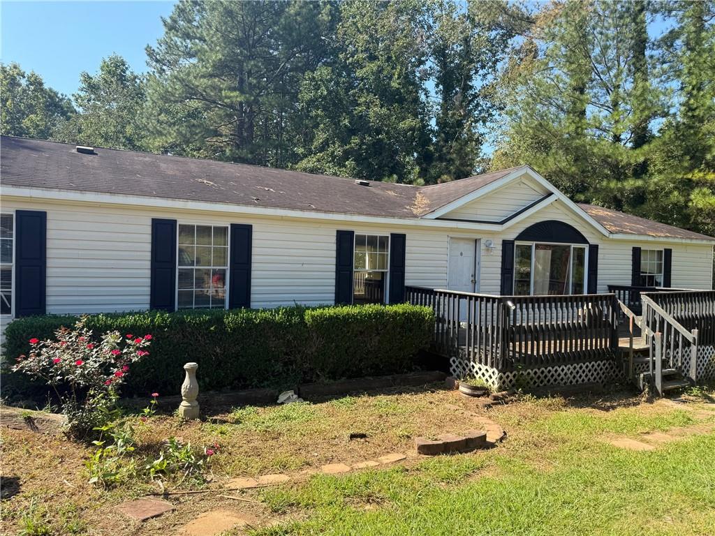Investor Special. Fixer-Upper near Lake Lanier. 3-bedroom, 2-bath mobile home on a large lot in a desirable location. Close to Lake Lanier and convenient to shopping and dining. Sold as-is. Bring your imagination and make this home your own.