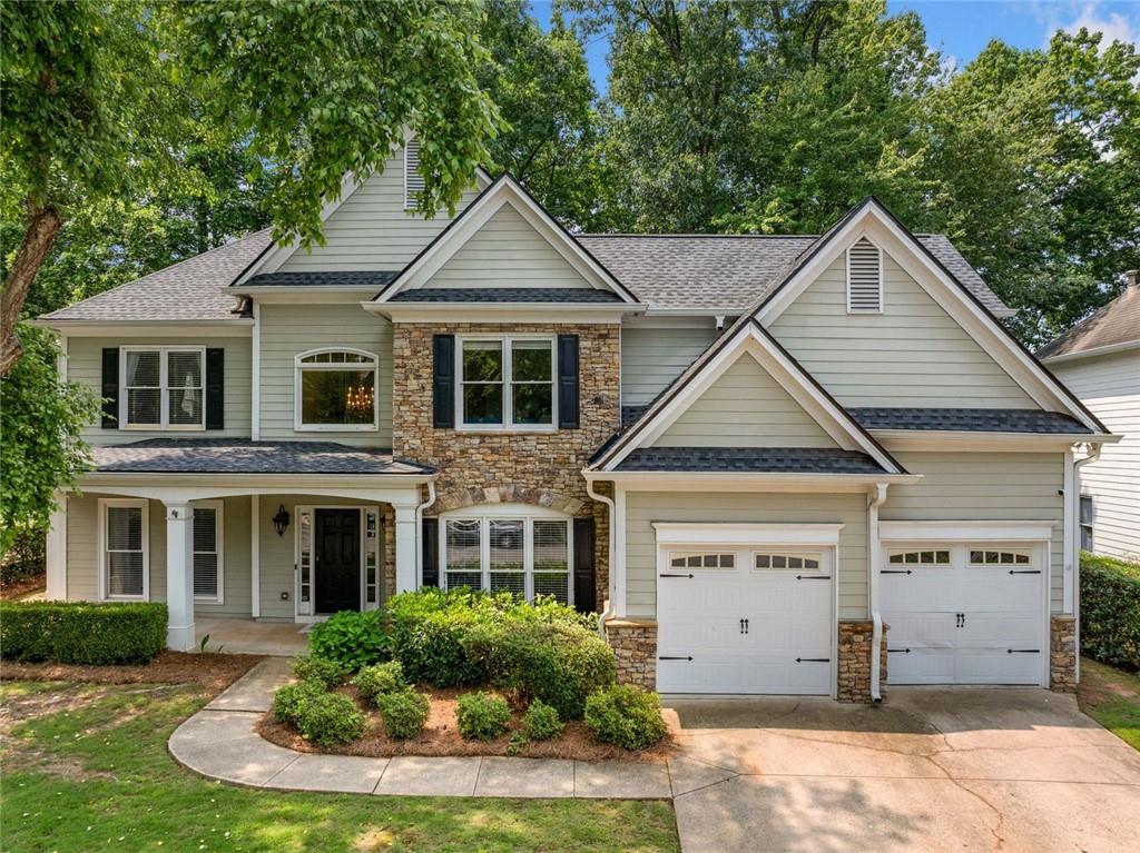 Beautifully updated home in the desirable Windward neighborhood and Alpharetta High School district. Located only 2.5 miles from Halcyon and 4 miles from Avalon, this house sits in a prime location. New hardwood floors in 2022, new roof 2023, new furnace 2022, new toilets 2022, new expansion tank 2025. total kitchen remodel 2023. Large deck for outdoor entertaining and a full backyard. Stunning two story stone fireplace in the family room. Open concept. The first floor bedroom currently acts as an office but has a closet. The half bath on the first floor can easily be opened to the first floor bedroom and expanded to a full bath to allow for a true guest suite. Home is fully updated but still has amazing potential for you to make it your own. Windward has a 200 acre lake, boat launch, and multiple parks. Come and make it yours today!