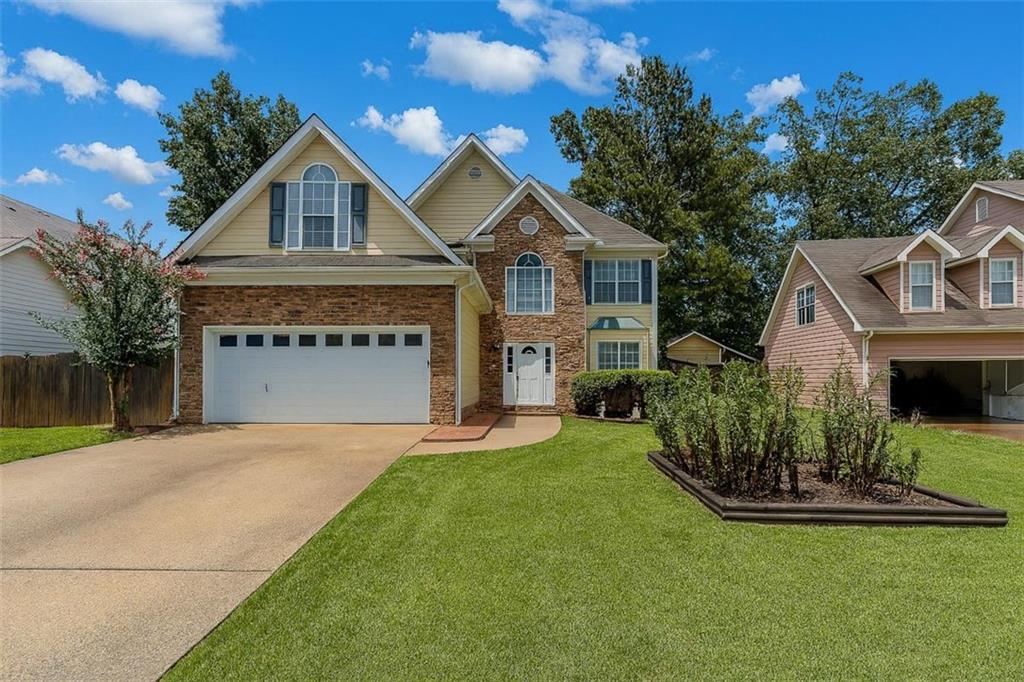 Welcome to 2812 Oak Vista Way, an exceptional opportunity in the desirable Winnsong Chase community of Gwinnett County. Priced below market value and located in a no-HOA neighborhood, this well-maintained home delivers immediate value and long-term upside for the right buyer. Significant updates have been completed in recent years, including a fully renovated primary bathroom featuring a floating tub, seamless glass shower, and wood-look tile floors. The secondary bathroom has also been upgraded with a dual vanity, quartz countertops, and modern fixtures. New flooring has been installed throughout the home. The HVAC system was most recently serviced in July 2025, the main water service line was replaced in 2021, and the roof is approximately eight years old.The home is conveniently located near major shopping centers, restaurants, and commuter routes. Zoned for J.A. Alford Elementary, Richards Middle, and Discovery High School, the location offers easy access to schools without the burden of HOA restrictions. Homes of this caliber, with extensive improvements and a competitive price point, are rare in this market. Multiple offers are expected. Submit your strongest offer early to avoid missing out on this unique opportunity.