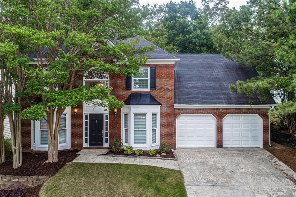 Welcome to this beautifully renovated 4-bedroom, 2.5-bathroom home that has undergone extensive upgrades, providing a perfect blend of modern elegance and comfort. Situated close to both Downtown Woodstock and Downtown Kennesaw, this property is convenient to local restaurants and shopping and provides easy access to I-75 express lanes. Both the interior and exterior of the home have been newly painted, and the fenced-in backyard provides both privacy and security for humans and pets alike. As you step inside, you'll immediately notice the gorgeous new hardwood floors that flow seamlessly throughout the main living areas. The large updated kitchen boasts brand new sleek countertops and ample cabinetry. The renovations also include a stunning, spa-like master bathroom. The luxurious space showcases modern fixtures, a large soaking tub, a separate glass-enclosed shower, and dual vanities. Each of the four bedrooms in the house has brand new carpet and ample closet space. New hardware and lighting have been added throughout the home. Neighborhood amenities include a pool, new pickleball courts (coming soon), and a large pond.