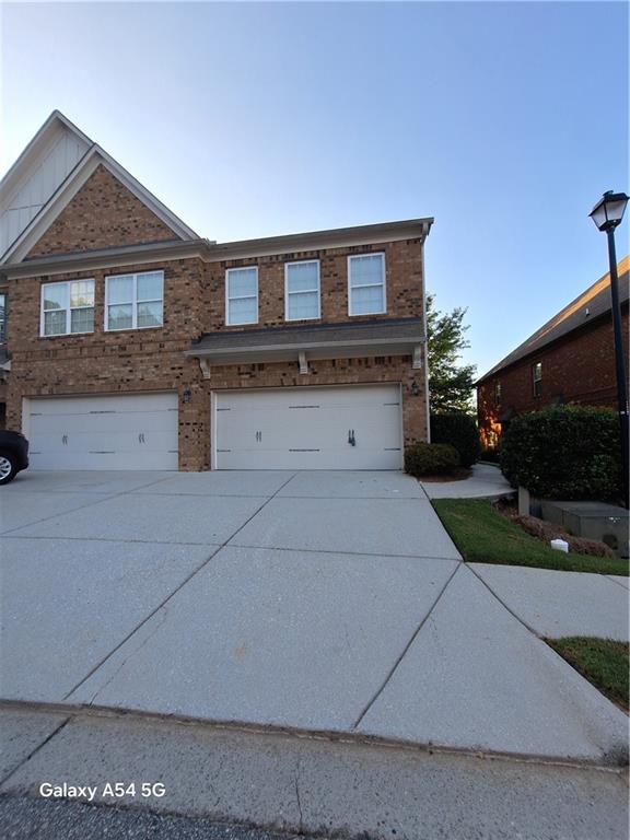 open-concept townhome in the gated Creekside Manor community, featuring a pool, and gated access.This beautifully designed home boasts a spacious, open-concept kitchen and living area—perfect for entertaining. The large eat-in kitchen includes countertop breakfast bar , Hardwood flooring upgrades extend throughout the entire home, adding warmth and sophistication. The laundry area is conveniently located downstairs. Upstairs, the expansive master suite offers a walk-in closet and a private master bathroom. Generously sized secondary bedrooms provide easy access to a full bath. Additional highlights include a spacious two-car garage and a prime location near I-85, with easy access to restaurants, shopping, and more!