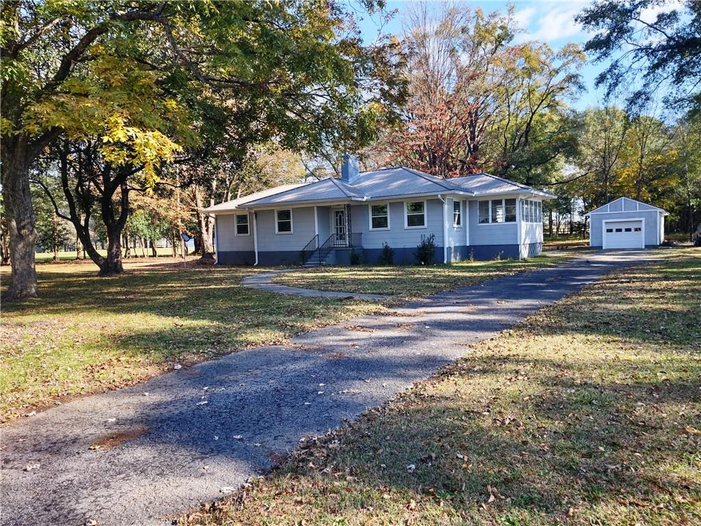 Great opportunity to own this recently remodeled 3 bedroom 2 full bath home on 1.89 acres on a dead end road. This year the home had all new windows replaced, new bathtub/ shower installed in the primary bath, electricity installed in the garage with automatic door opener. The septic system was serviced and pumped also. In 2022 the home was renovated with new metal roof, new HVAC, water heater, all new laminate hardwood flooring, updated kitchen with all new stainless appliances. There is a sunroom off the kitchen. This home needs nothing! Location is awesome with large hardwood trees, level lot with spacious open lots across the street and next door. Seller will need 7 days after closing to vacate the property. No showings after 5 on Friday or anytime on Saturday. This home is in the USDA eligible 100% no down payment area.