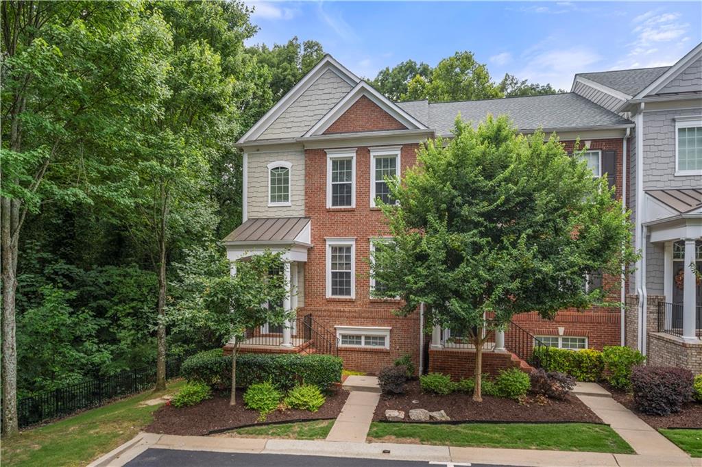 Gorgeous end unit townhome w/ 3 finished levels in a desirable gated Brookhaven neighborhood. Open floorplan, gleaming grey hardwood floors, designer lighting, fireplace in family room, built in speakers throughout, gourmet kitchen, granite, stainless appliances, tiled backsplash, large master w/ trey ceilings, double vanity, private rear deck that overlooks quiet forest. Completely updated. Very quiet, private location! Minutes away from Buckhead, top shopping, dining, and easy highway access!