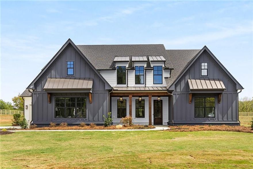 Finished and ready to close! Don't miss this opportunity to own a brand new home in Alpharetta on 2.43 acres, just a few miles from Milton/Crabapple restaurants and shops. This modern farmhouse, features an abundance of windows overlooking the spacious private yard perfect for a pool. You will love the retractable glass doors that from the family room to the covered porch making indoor-outdoor living and entertaining easy! Enjoy the outdoor fireplace with a view to the spacious level backyard. The designer kitchen includes floor to ceiling Woodmont cabinetry, huge island with quartz countertops, a walk in pantry, Thermador appliances and a built in refrigerator with a cabinet panel front. The keeping room off the kitchen is a great place for the kitchen table or a sitting area. The formal dining and family room are great areas for family and friends to gather. As you walk in from the 3 car garage, there is a mudroom with a bench and large closet for coats and shoes. Serenity awaits in main floor owners suite, the incredibly designed owners bath includes exquisite tile, freestanding soaking tub, a double vanity with quartz tops, plenty of linen space, an enclosed water closet, custom tiled shower and a walk-in closet, complete with a washer and dryer hook up for the ultimate convenience. Upstairs you will find four oversized bedrooms and three full bathrooms that will provide plenty of space for family and guests. There is also a spacious media room that can be used for movie nights, exercise room, home office, the possibilities are endless. Some amazing features not to miss are an exquisite lighting package from Visual Comfort, wood floors throughout the main level and upper level hallway, custom iron railings, multi zone irrigation system, wood shelving in the closets and linens, spray foam insulation in the attic, tankless water heater, four rail fence around the front and backyard. Includes a 2-10 warranty that covers mechanicals and 10 year structural. Don't delay, come and see this home today. Photos showing the pool are representative of what the yard would look like if a pool was added.