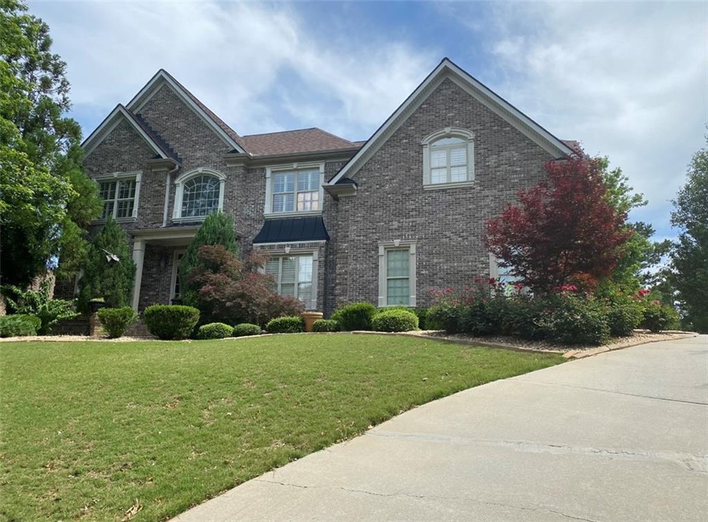 Welcome to this stunning 4-sided brick home perfectly situated on the golf course, offering elegance, comfort, and breathtaking views. With 4 spacious bedrooms, 3 full baths, and 2 half baths, this home is designed for both everyday living and entertaining. Step inside to find an inviting layout with abundant natural light, hardwood floors, and timeless architectural details. The chef's kitchen opens to a warm and welcoming family room with views of the course, creating the perfect backdrop for gatherings. A formal dining room and separate living space add to the home's charm. The primary suite is a true retreat, featuring a spa-like bath and ample closet space. Secondary bedrooms are generously sized, providing comfort for family or guests. The fully finished basement offers endless possibilities-whether you envision a home theater, game room, gym, or additional living quarters, the space is ready to fit your lifestyle. Outside, enjoy serene mornings and relaxing evenings on the deck or patio, overlooking the lush greens of the golf course. The home's 4-sided brick construction ensures both beauty and durability, while the setting offers a lifestyle of leisure and prestige. This is more than just a home-it's an opportunity to live where elegance meets convenience, with golf, dining, and recreation right at your doorstep.