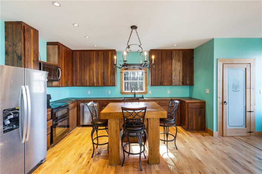 Charming Cabin Ranch ideally located just off Highway 411 and only minutes from I-75! The kitchen features laminate countertops and opens seamlessly into the cozy family room. Both bathrooms have been beautifully updated with new tile, vanities, and fixtures. New hardwood flooring flows throughout the home. The master bedroom boasts a spacious walk-in closet for added convenience. Enjoy outdoor living with an amiable screened-in porch and a covered patio, perfect for relaxing or entertaining. The detached garage provides the ideal space for a workshop. PROPERTY BEING SOLD WITH 2 ADDITIONAL LOTS!
(0089A-0002-006 & 0089A-0002-014) totaling .98 Acre, offering plenty of potential for expansion or outdoor activities. This move-in-ready home is a must-see!