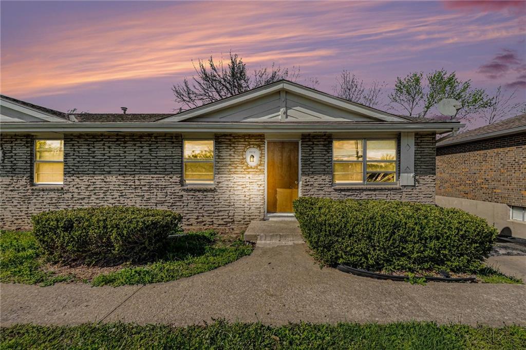 Virtually enhanced with twilight look for sky and interior lights on in windows