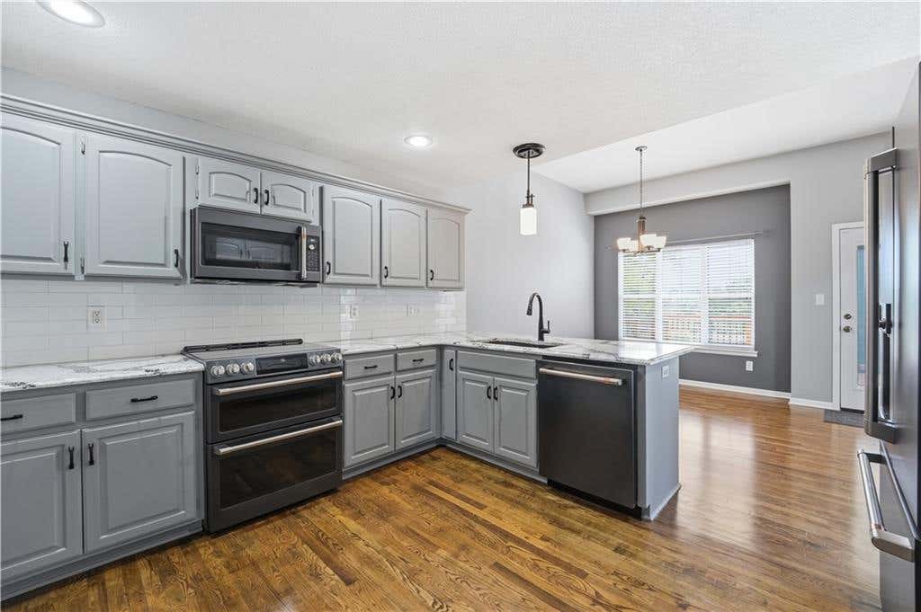Photo of 1305 SW Crystal Creek Place SW, Blue Springs, MO 64015 (MLS # 2623030)
