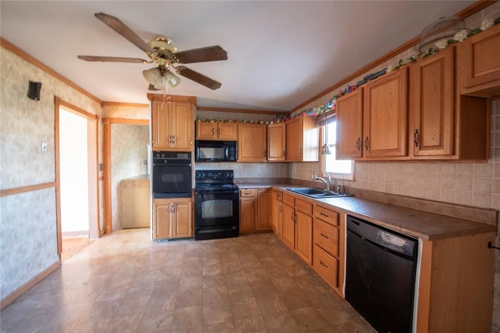 Photo of 7000 Rowland Avenue, Kansas City, KS 66109 (MLS # 2592549)