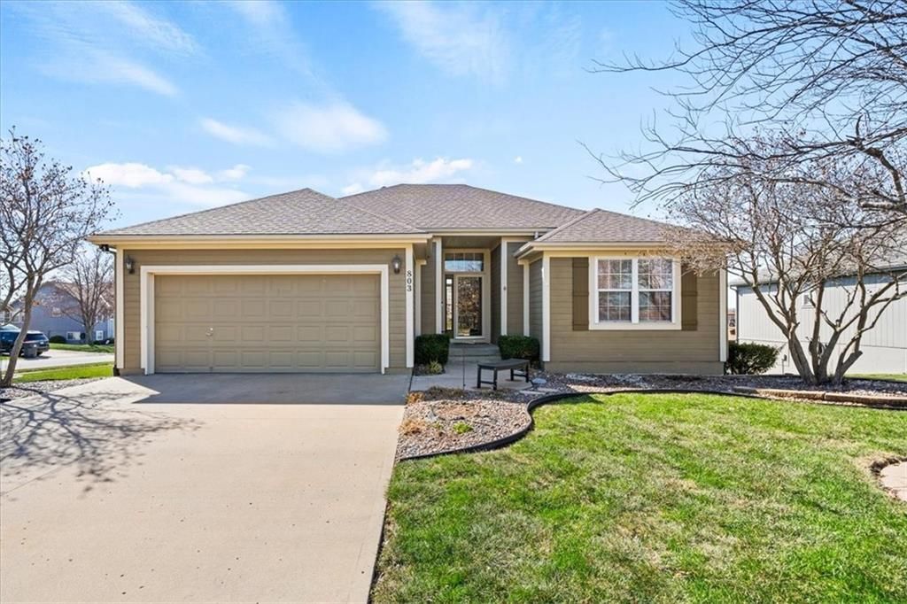 Photo of 803 NW Redbud Drive, Grain Valley, MO 64029 (MLS # 2607648)