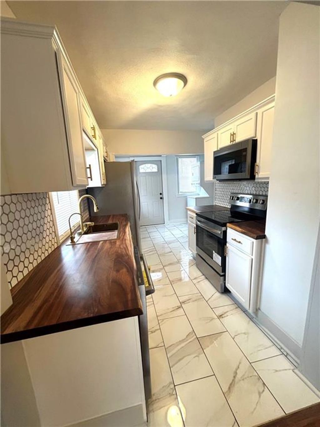 Photo of 2410 Myrtle Avenue, Kansas City, MO 64127 (MLS # 2598800)