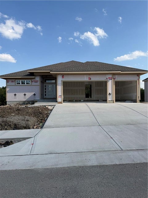 Photo of 831 Reed Drive, Raymore, MO 64083 (MLS # 2643737)