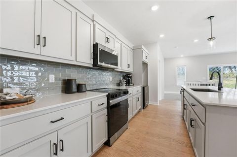 Photo of 1204 Royal Arch Trail, Raymore, MO 64083 (MLS # 2627379)