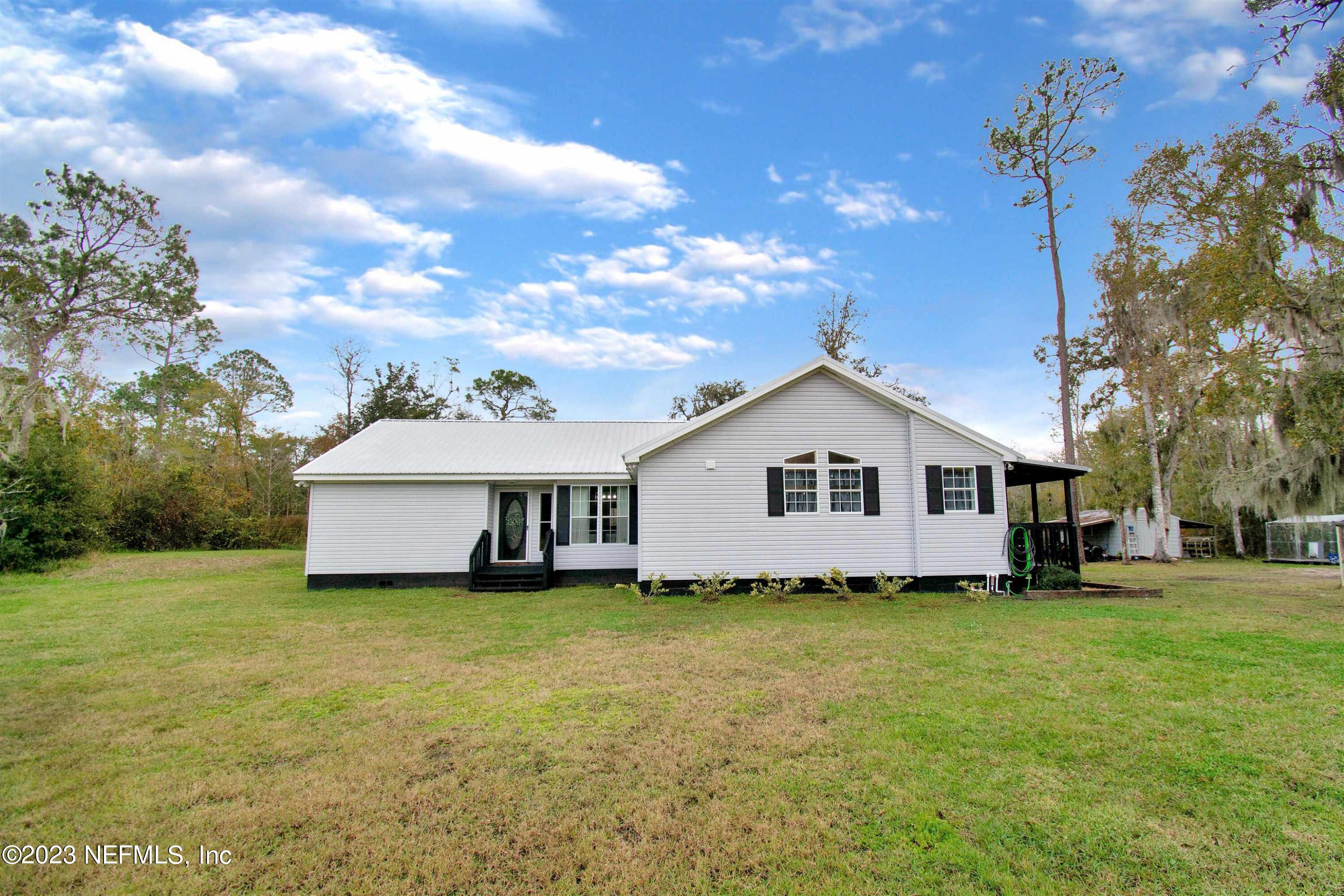 St Augustine, FL home for sale located at 7165 Woodward Road, St Augustine, FL 32092