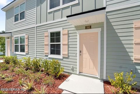 Photo of 592 RUNNING WOODS Street, Orange Park, FL 32065 (MLS # 2152052)