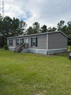 Photo of 18285 BROKEN ARROW Road, Hilliard, FL 32046 (MLS # 2164595)