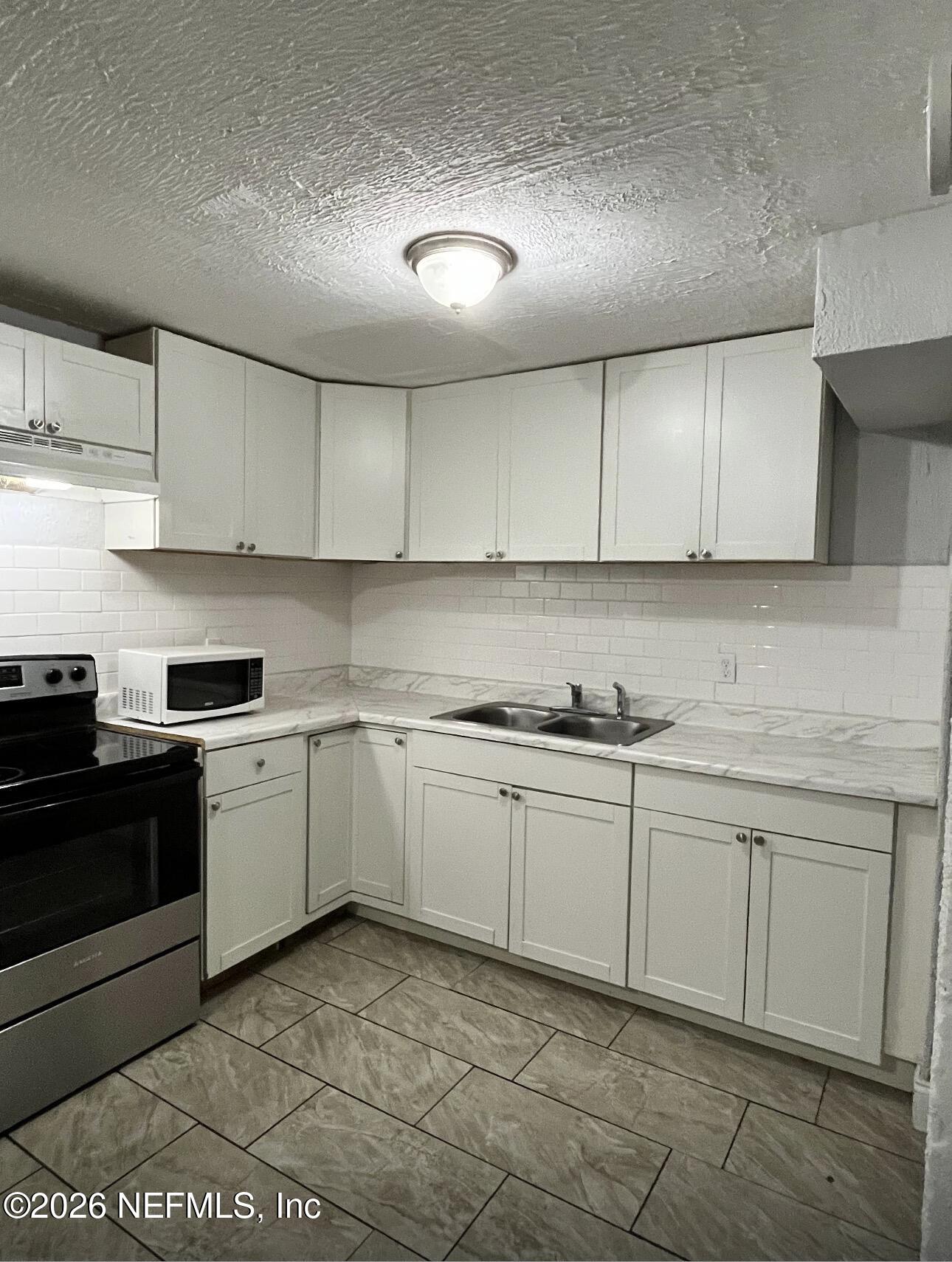 Photo 1 of 18 — 4413 MONCRIEF Road W, Jacksonville, FL 32209