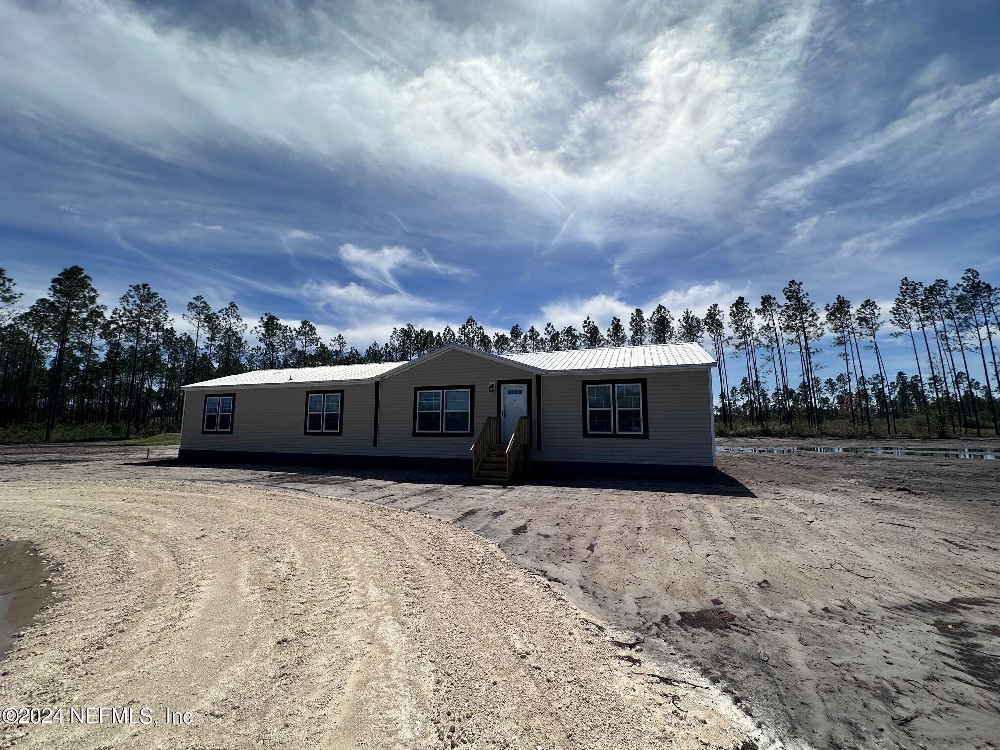 Glen St. Mary, FL home for sale located at 8682 Noah Davis Road, Glen St. Mary, FL 32040