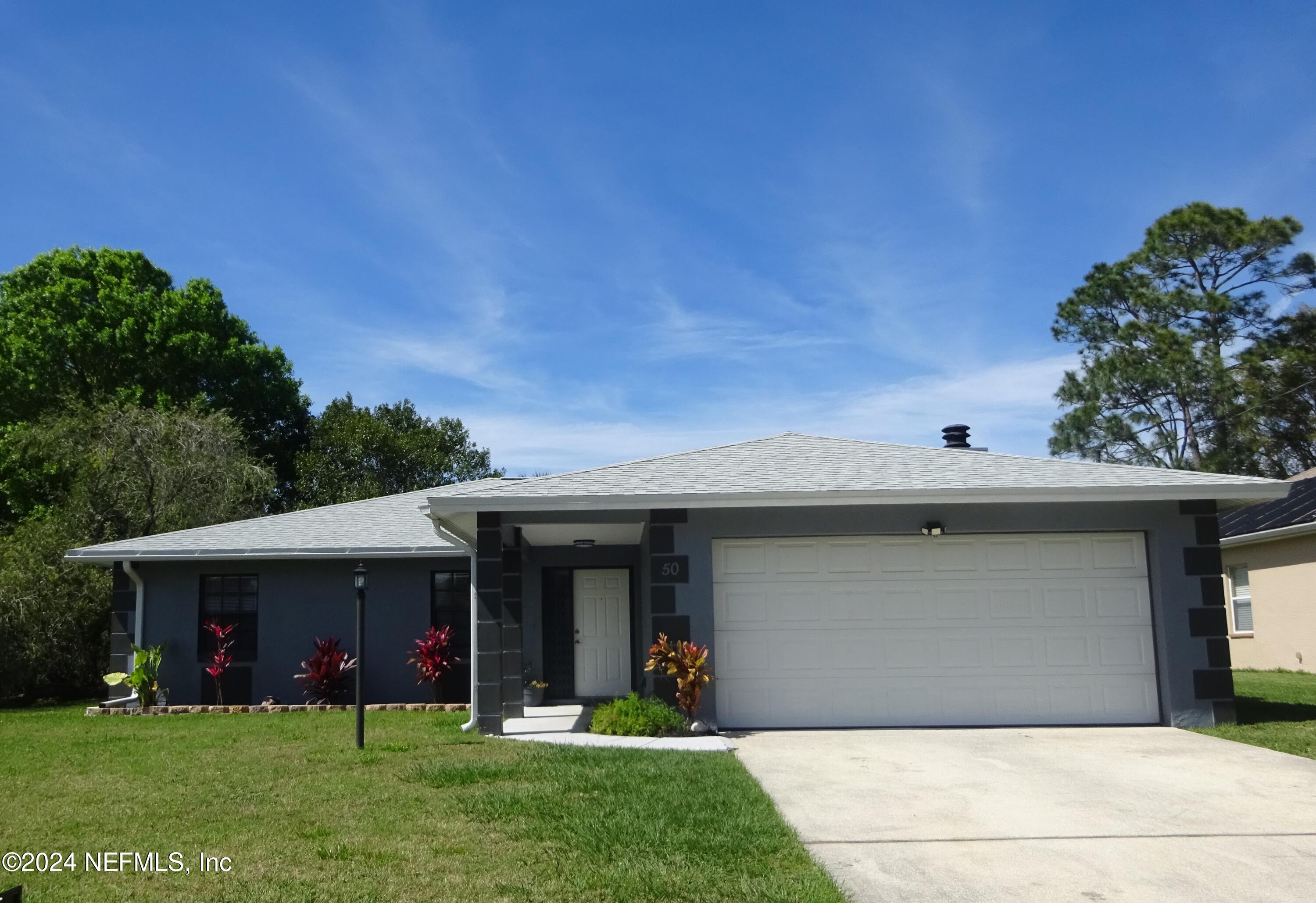 Palm Coast, FL home for sale located at 50 WESTHAMPTON Drive, Palm Coast, FL 32164