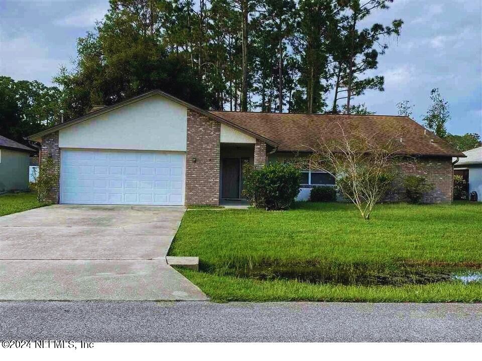 Palm Coast, FL home for sale located at 57 BASSETT Lane, Palm Coast, FL 32137