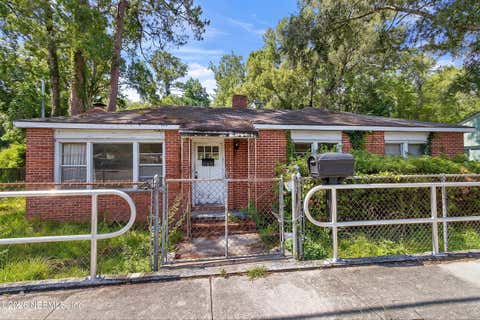 Photo of 4604 TIMUQUANA Road, Jacksonville, FL 32210 (MLS # 2156193)