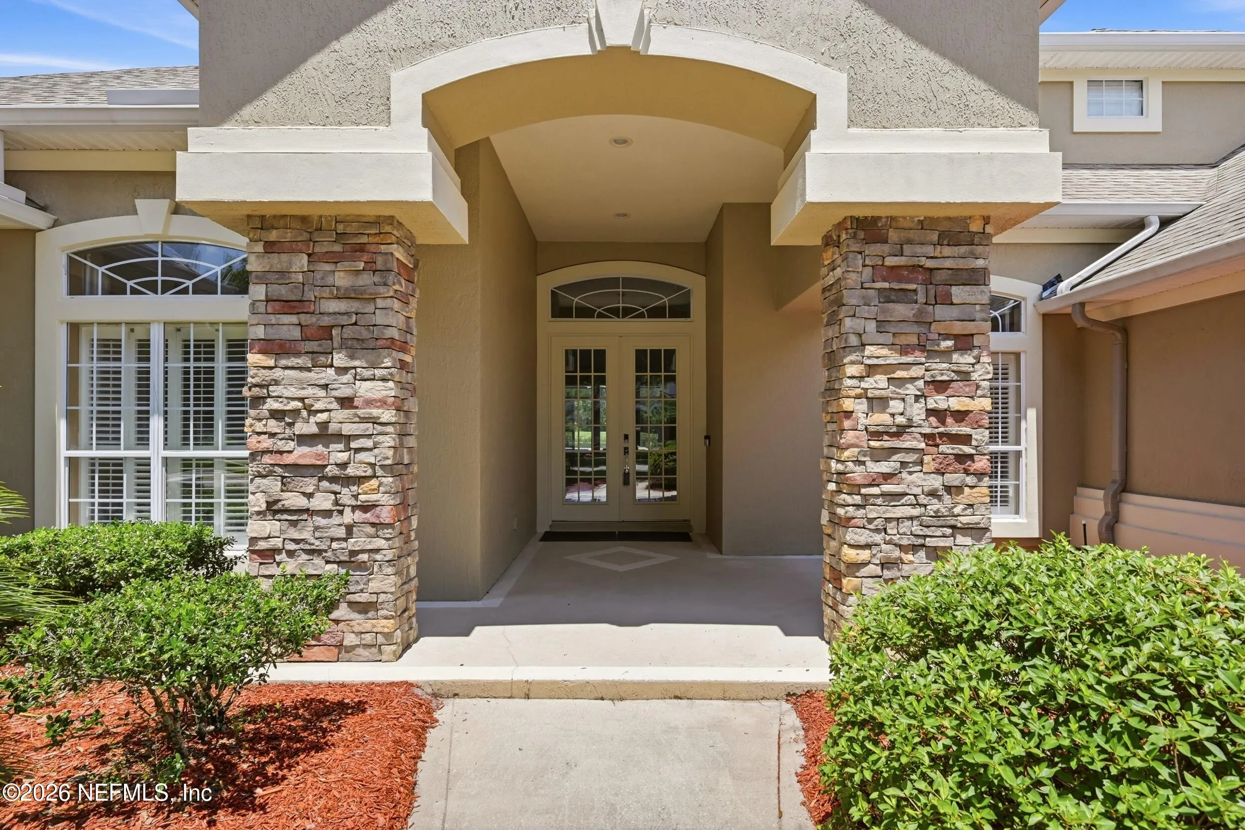 Tucked away on a rare .9-acre homesite in the sought-after South Hampt – image 2