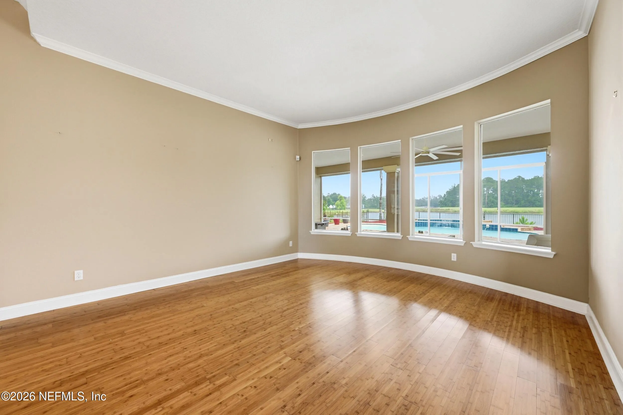 Tucked away on a rare .9-acre homesite in the sought-after South Hampt – image 9